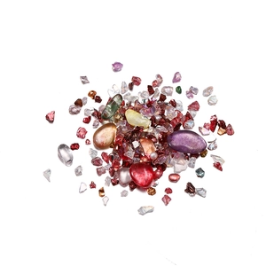 Macro shot of colorful iridescent irregular glass stones for DIY crafts and nail art
