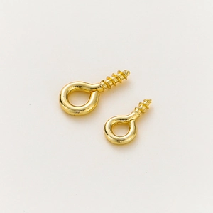 Macro shot of gold-plated eye-screw pins in two lengths for DIY jewelry pendant making