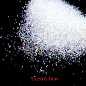Macro view of 0.8-1mm iridescent clear glass bubble beads for DIY crafts and nail art