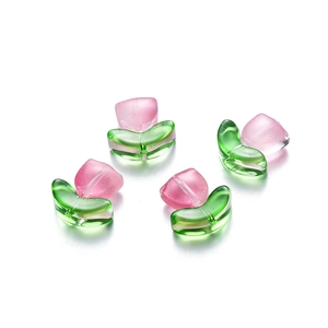 Detailed view of pink glass tulip beads with green leaves for DIY jewelry making