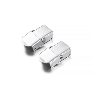 Close-up of polished stainless steel watch strap folding buckles with dual push buttons