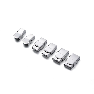 Macro view of six silver stainless steel folding watch clasps for DIY strap replacement