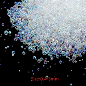 Macro shot of 0.4-3mm iridescent glass bubble beads for DIY resin art and nail decoration