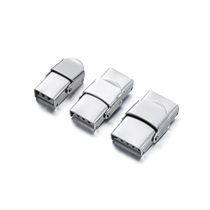 Detailed macro view of three polished stainless steel watch folding clasps in silver finish
