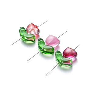 Macro detail of tulip glass beads in three colors for DIY jewelry making and crafts