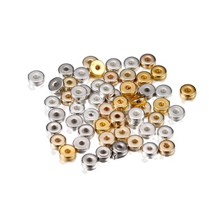 Close-up of polished metallic round spacer beads in gold silver and rose gold for DIY jewelry