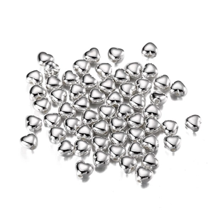 Detailed view of silver heart-shaped CCB beads with through-holes for DIY jewelry making