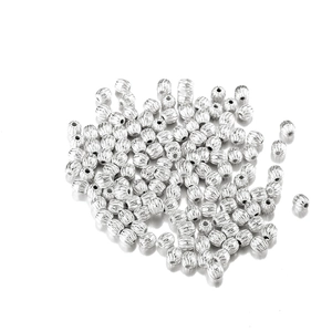 Macro view of silver striped round CCB beads with central hole for DIY jewelry making