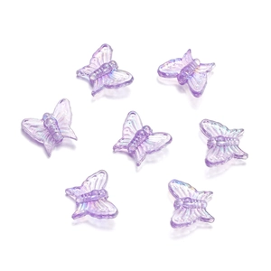 Detailed macro view of 13mm iridescent purple acrylic butterfly beads for DIY crafts