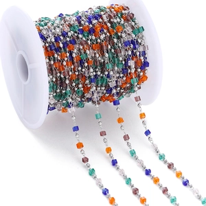 Colorful cube crystal beads and silver metal round beads chain on white spool for DIY jewelry