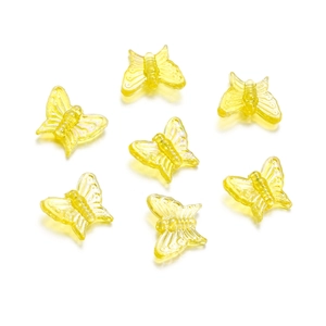 Macro shot of 13mm yellow acrylic butterfly beads for DIY jewelry and hair accessories