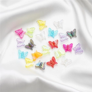 Macro shot of colorful 13mm acrylic butterfly beads with iridescent AB coating for DIY