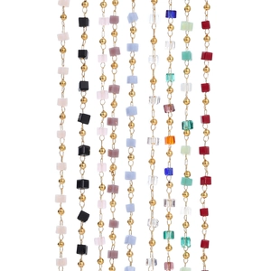 Detailed view of colorful cube beads and gold round beads on DIY jewelry chains