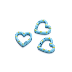 Detail of sky blue heart-shaped metal spring buckles with yellow polka dots for DIY jewelry