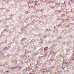 Macro detail of lavender heart glass beads with internal gold shimmer for DIY jewelry
