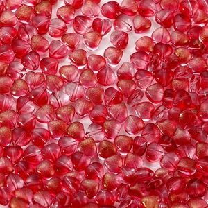 Detail of red heart-shaped glass beads with gold foil flecks for jewelry making