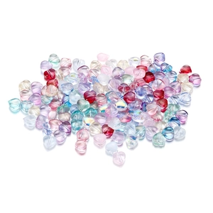 Macro shot of colorful heart-shaped glass beads with glossy and frosted finishes for DIY jewelry