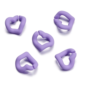 Macro view of five purple matte acrylic heart rings for DIY jewelry and phone chains