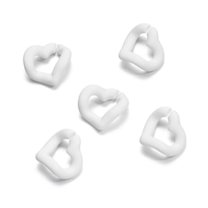 Detail of five white heart-shaped silicone knitting stitch markers on a white background