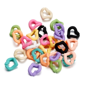 Close-up of matte heart-shaped acrylic links for DIY jewelry and phone chain making