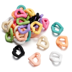 Macro shot of colorful matte heart-shaped acrylic chain links for DIY mobile accessories