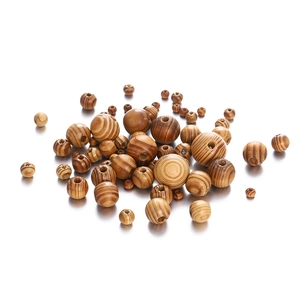 Macro view of natural maple wood beads with unique grain patterns for DIY jewelry making