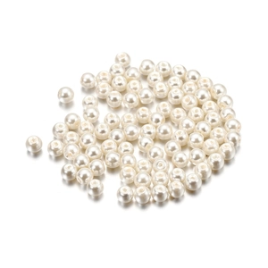 Macro shot of 4mm cream glass imitation pearl round beads with holes for DIY jewelry