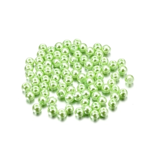 Detailed view of 4mm light green faux pearl glass beads with holes for DIY jewelry