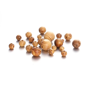 Various sizes of maple wood beads with natural brown stripes and pre-drilled holes