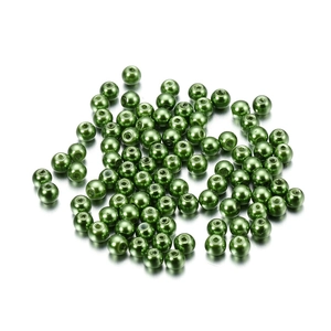 Close-up of 4mm metallic emerald green glass pearl beads for DIY jewelry making and crafts