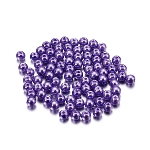 Close-up of 4mm deep purple glass imitation pearl beads with smooth lustrous finish