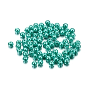 Macro shot of 4mm mint green glass imitation pearls with center holes for DIY jewelry