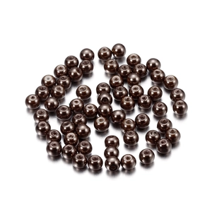 Macro view of 4mm coffee brown glass pearls with polished finish and center drill holes