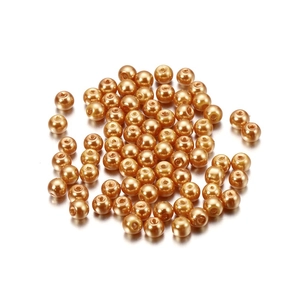 Macro view of 4mm amber gold round glass faux pearl beads for DIY jewelry making