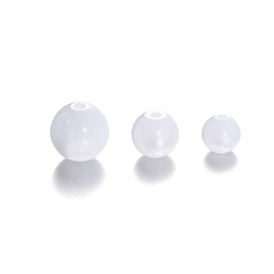 Detailed view of three sizes of round resin faux cat-eye beads with pre-drilled holes
