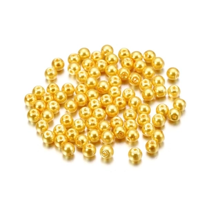 Detail of 4mm bright gold glass imitation pearls with center holes for DIY jewelry making