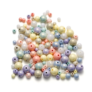 Macro shot of macaron acrylic pearl beads with glossy finish for DIY jewelry crafting