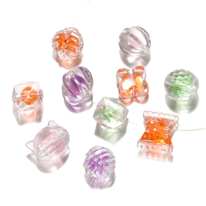 Detailed view of mixed acrylic frosted beads in candy and animal shapes for DIY jewelry