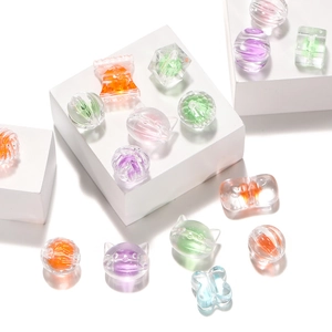 Detail of colorful transparent acrylic beads in candy and heart shapes for DIY jewelry