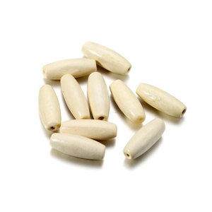 Macro shot of oval cream maple wood beads with 2.5mm hole for DIY jewelry making