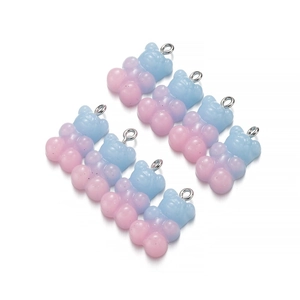 Detailed view of pink and blue gradient resin gummy bear charms for DIY jewelry making