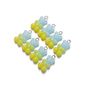 Set of eight gradient blue and yellow resin bear pendants with silver metal rings