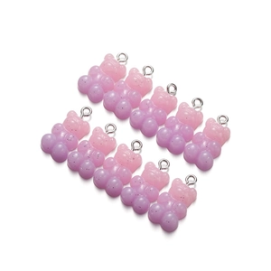 Close-up of 10 gradient pink and purple resin bear charms with silver metal loops