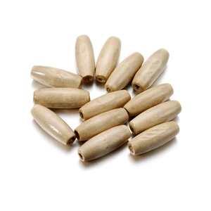 Macro view of polished oval maple wood beads with 2.5mm hole for DIY crafts and jewelry