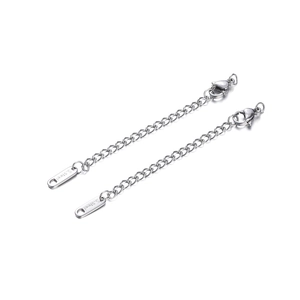 Macro detail of silver stainless steel extender chain with lobster clasp and S.steel tag