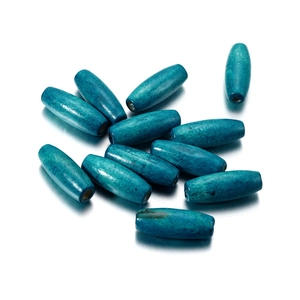 Macro detail of oval wooden beads with teal finish and natural grain for DIY crafts