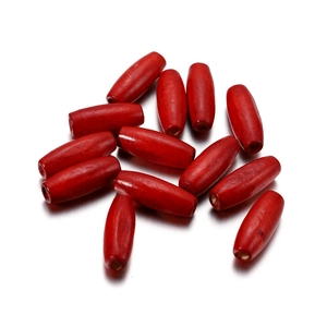 Macro shot of bright red oval wooden beads with 2.5mm hole for DIY handmade jewelry
