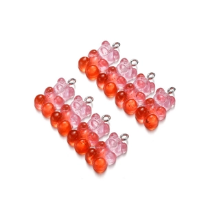 Macro shot of 8 gradient resin gummy bears with silver jump rings for DIY jewelry