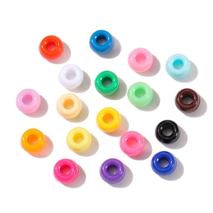 Close-up of colorful acrylic large-hole barrel beads for DIY jewelry and necklaces