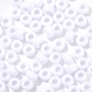 Macro shot of glossy white acrylic pony beads with large holes for DIY jewelry making